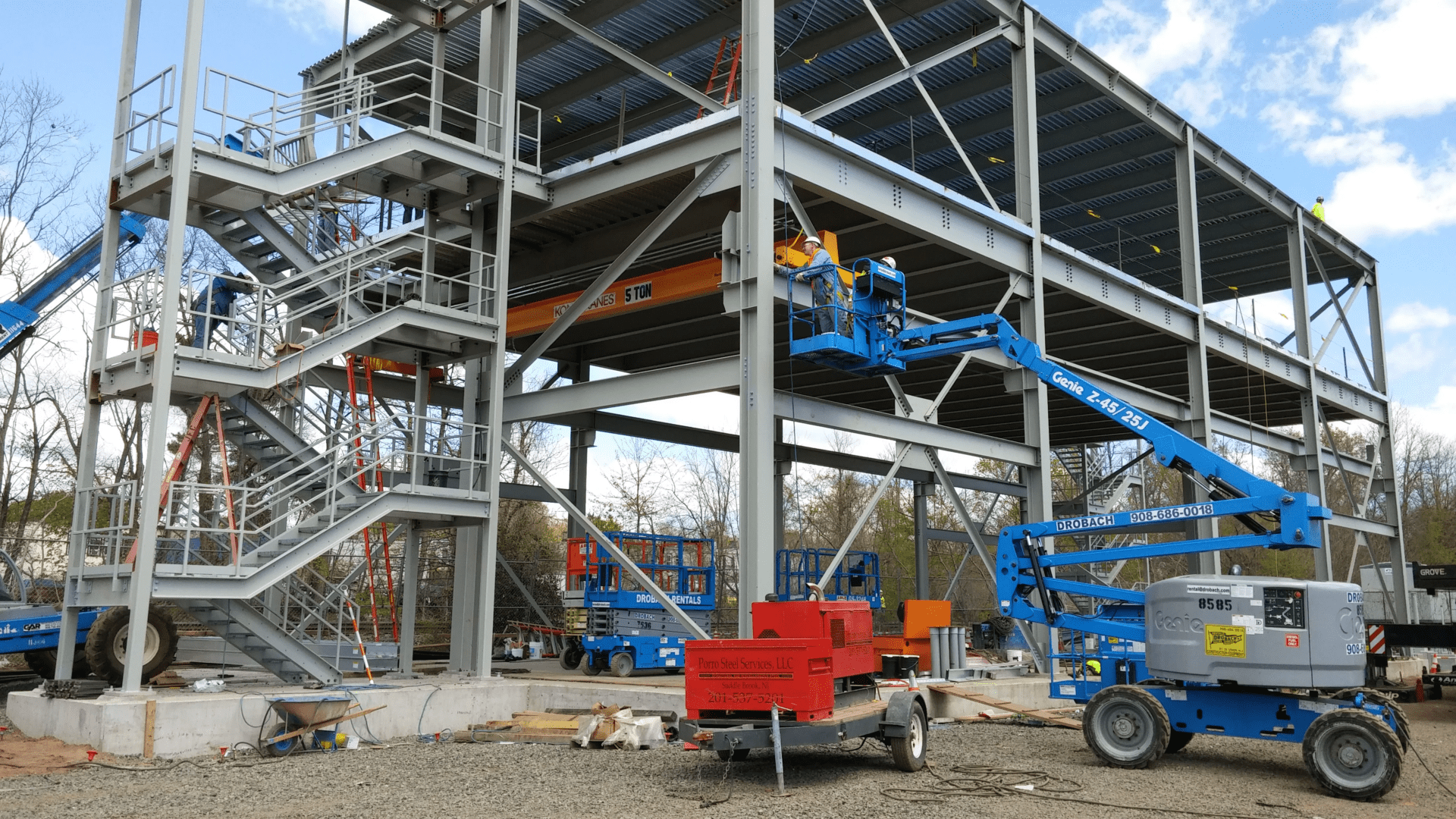 man on a crane working on a building